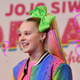 Image for article titled Does Jojo Siwa Get Ariana Grande-Level Ponytail Headaches?